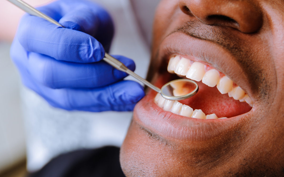 African male patient getting dental treatment in dental clinic